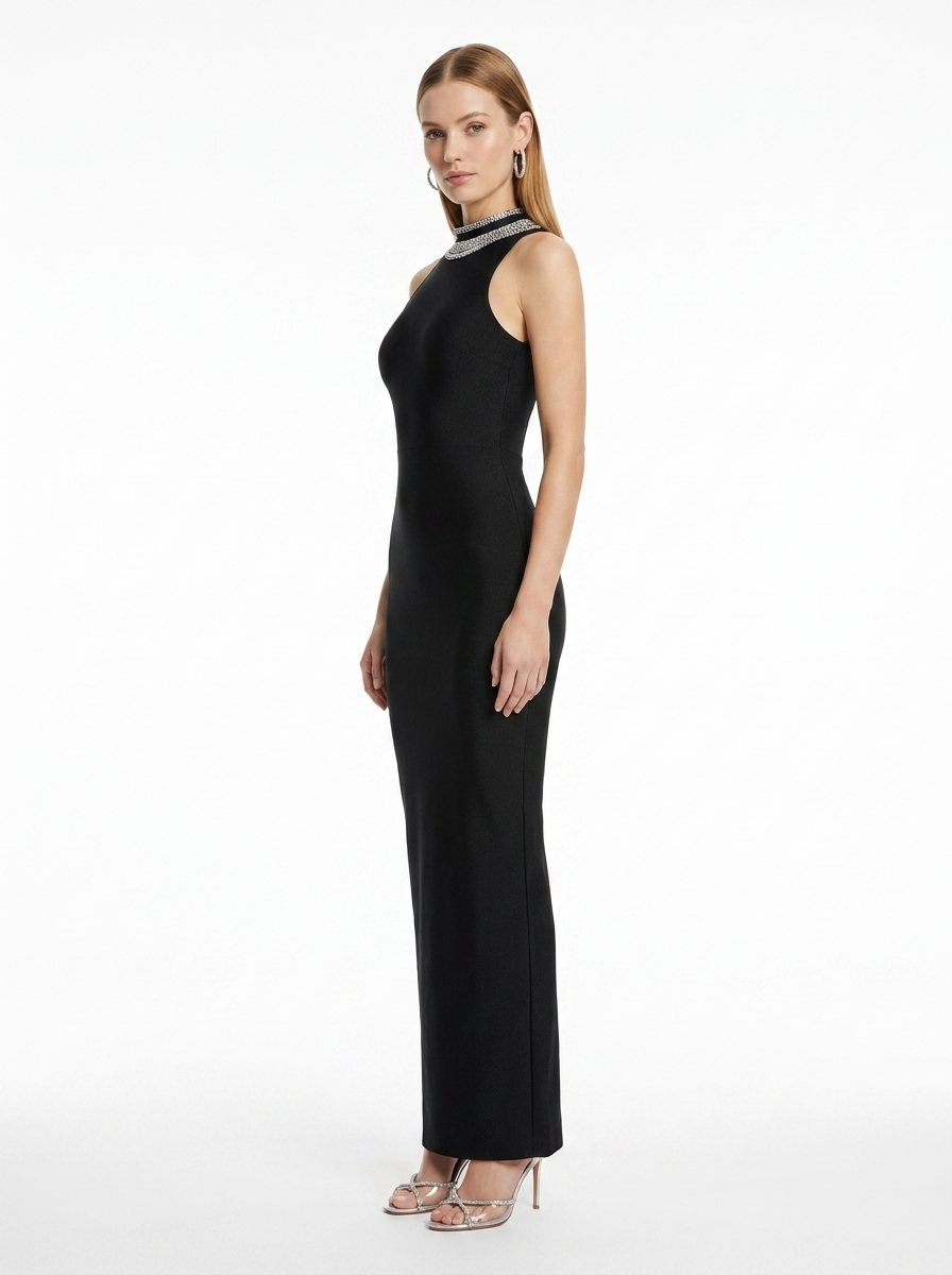 Woman wearing a black evening gown on a white background