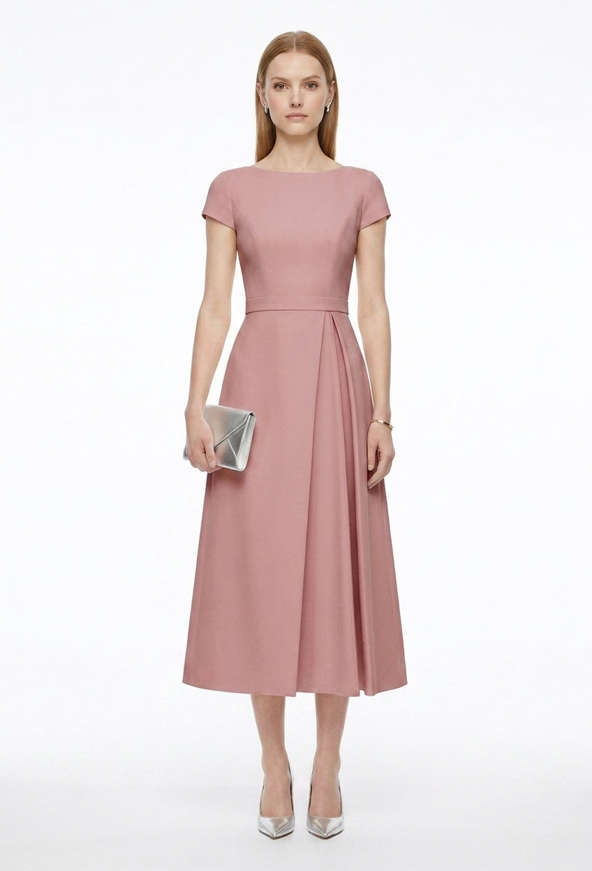 Woman wearing a pink dress on a white background
