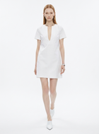 Woman wearing a white dress on a white background