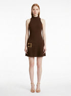 Woman wearing the Gold-Buckle Mini Dress in Chocolate Brown featuring gold square buckle, front view on a white studio background