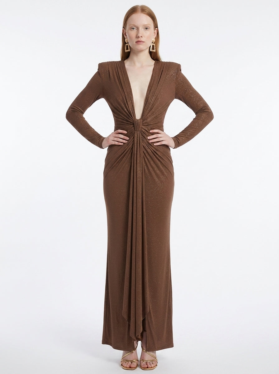 Woman wearing a brown evening gown on a white background